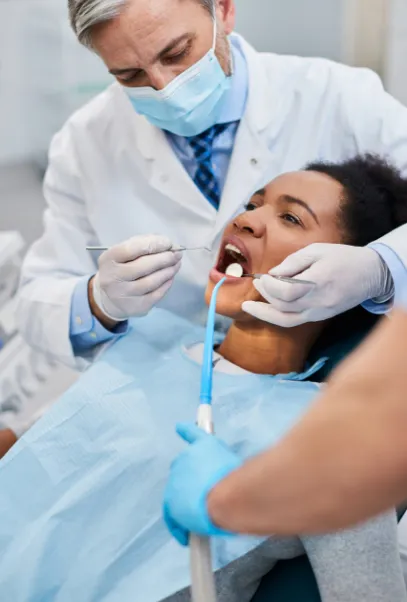 Female patient being examined by dentist