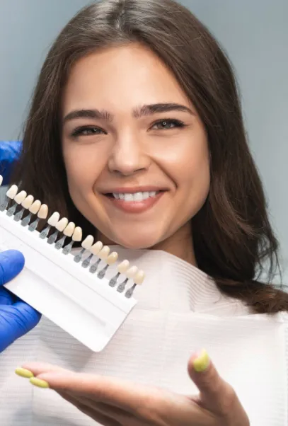 Female patient having teeth shade matched for cosmetic dentistry